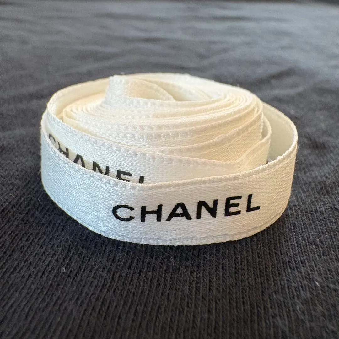 Thumbnail of Authentic CHANEL ribbon with logo, white, 1cm wide x approx. 140cm