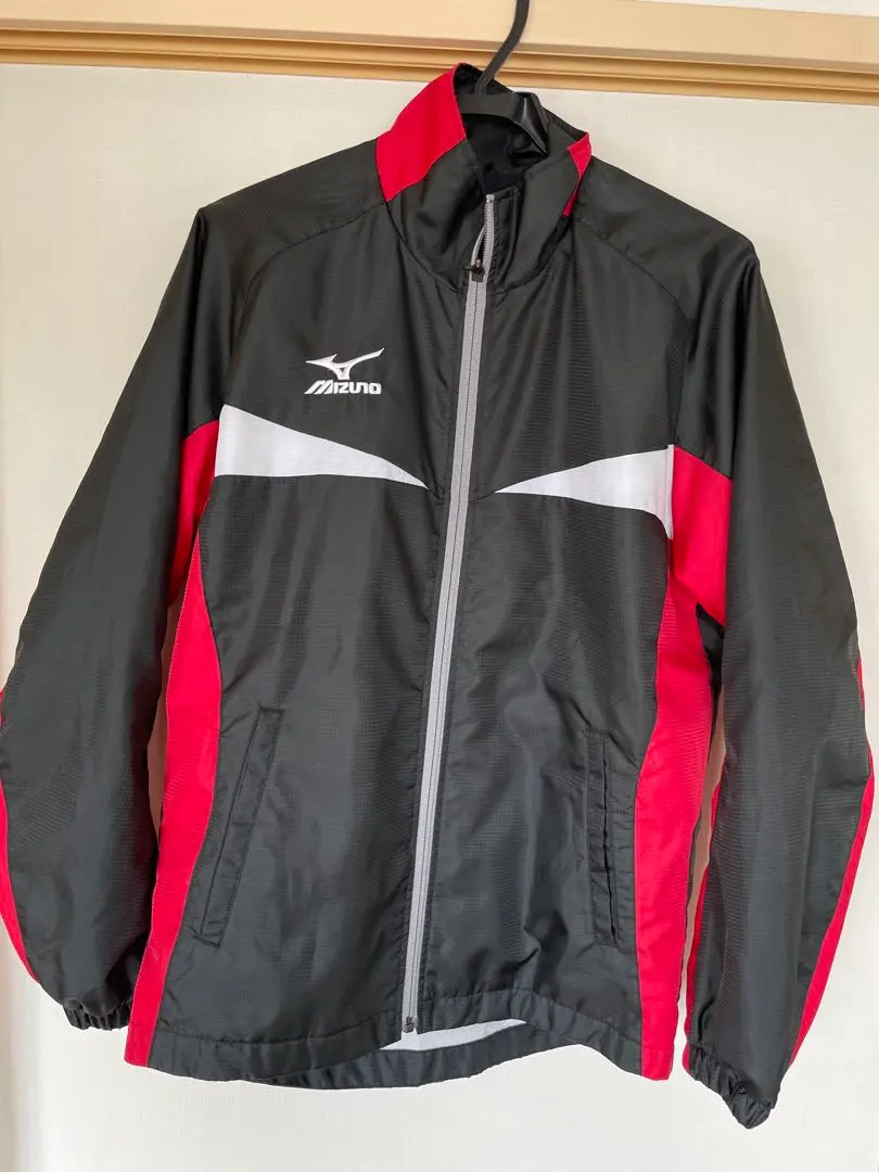 Thumbnail of Mizuno zip-up jacket, black and red. Size: Unisex SS
