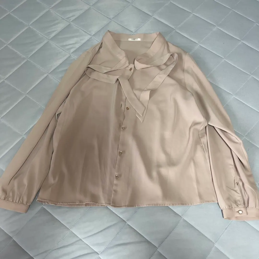 Thumbnail of Beige long-sleeved shirt with a ribbon