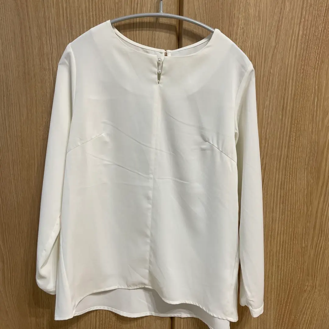 Thumbnail of White long-sleeved shirt, size M, with new tags, DRESKIP