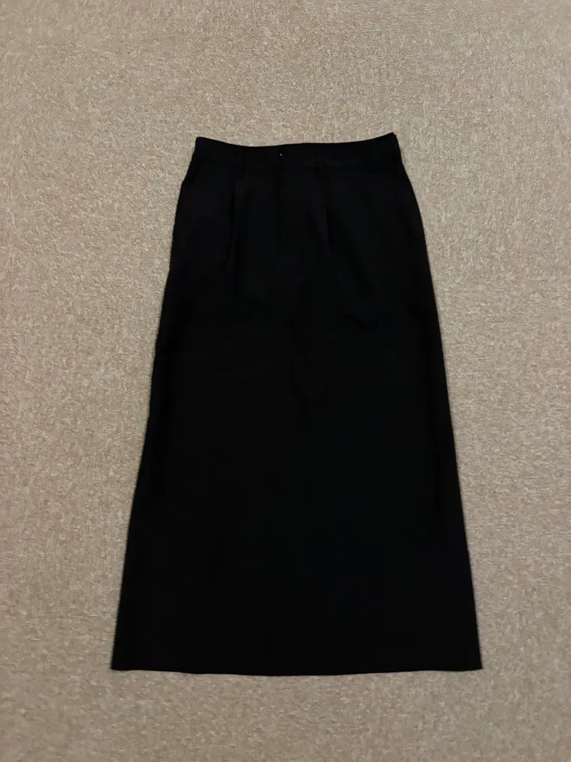 Thumbnail of Black tight skirt with front tucks and buttons