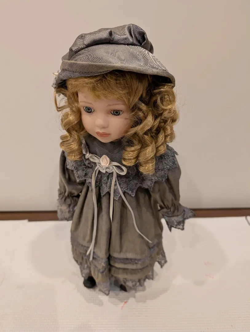 Thumbnail of Bisque doll, French antique doll, porcelain doll, doll in a gray dress