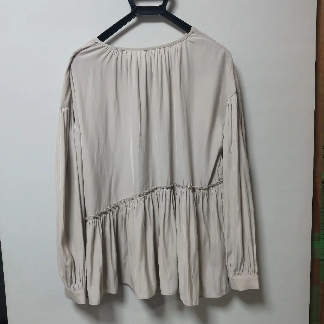 Thumbnail of Beige flared silhouette long-sleeved shirt