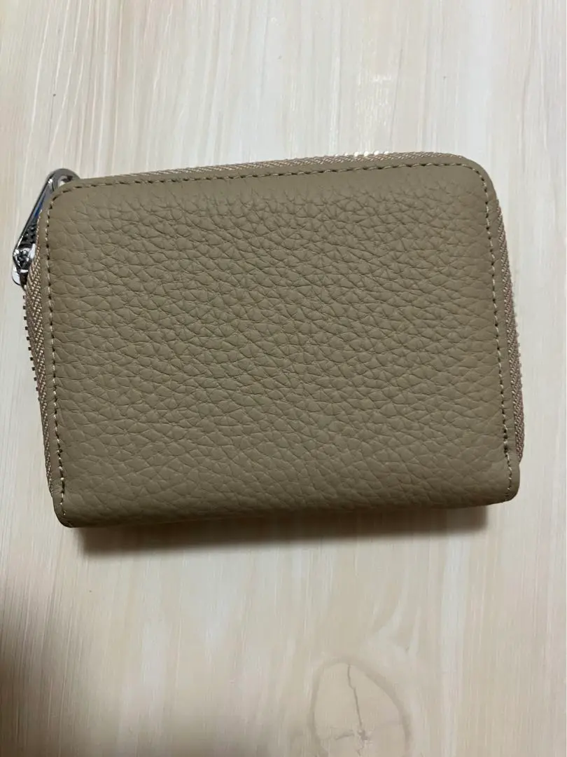 Thumbnail of Beige leather coin case, new and unused
