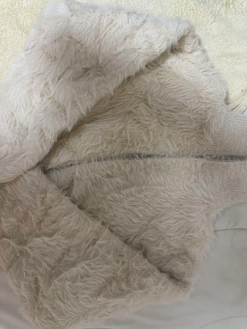 Thumbnail of Cream-colored faux fur cardigan, long sleeves