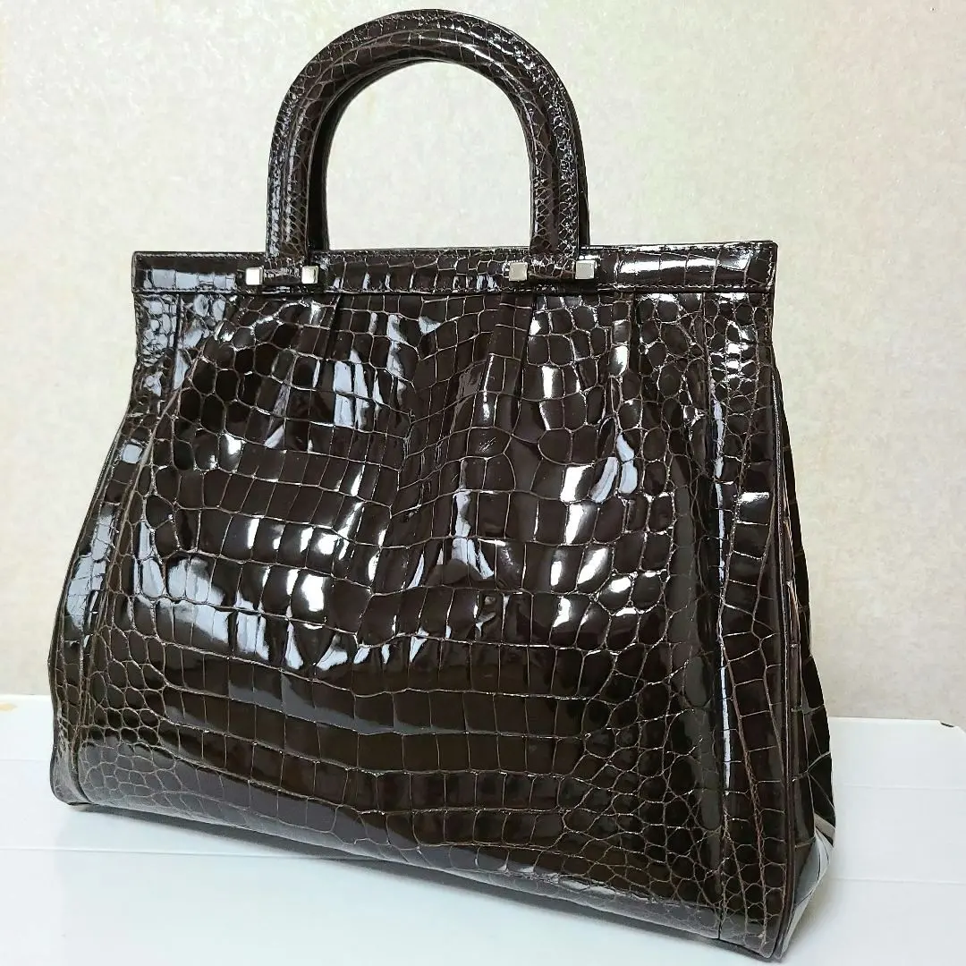 Thumbnail of Shiny crocodile skin bag, dark brown, beautiful condition