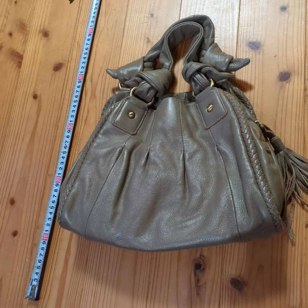 Thumbnail of Olive green leather tote bag with fringe