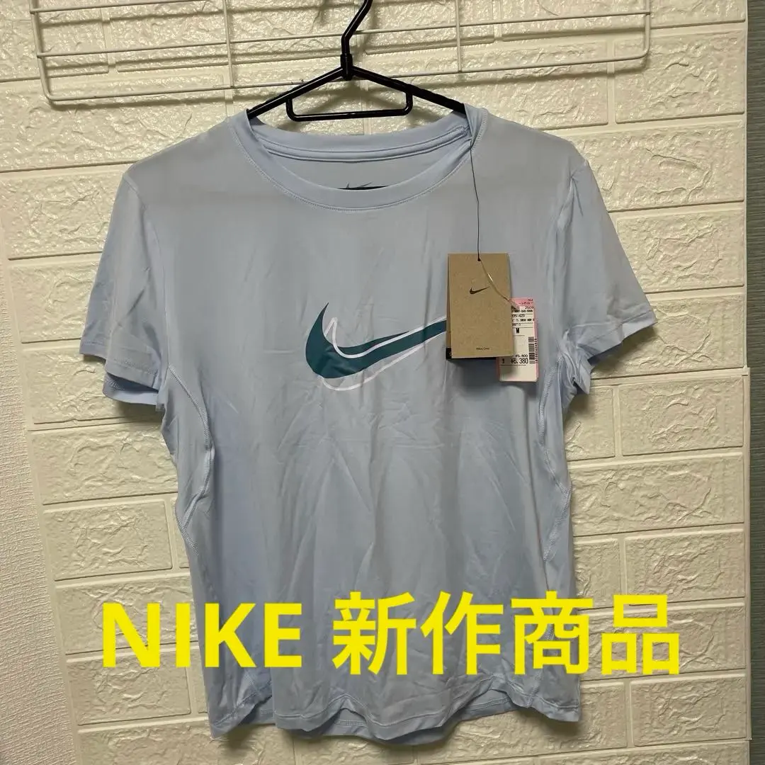 Thumbnail of Nike light blue T-shirt, size M