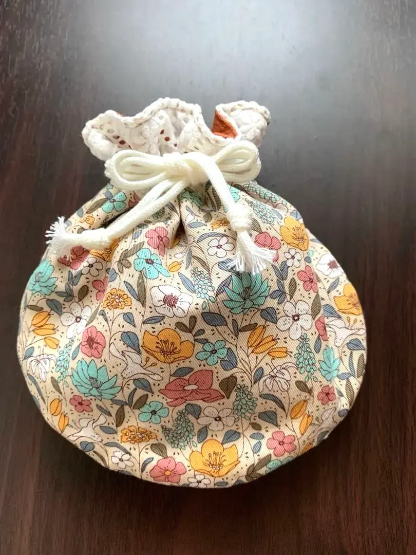 Thumbnail of Handmade lace and floral fabric (orange) round drawstring bag