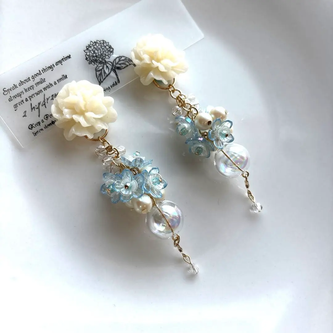 Thumbnail of Off-white flower x clear dome ♡ Light blue flower Spring color earrings