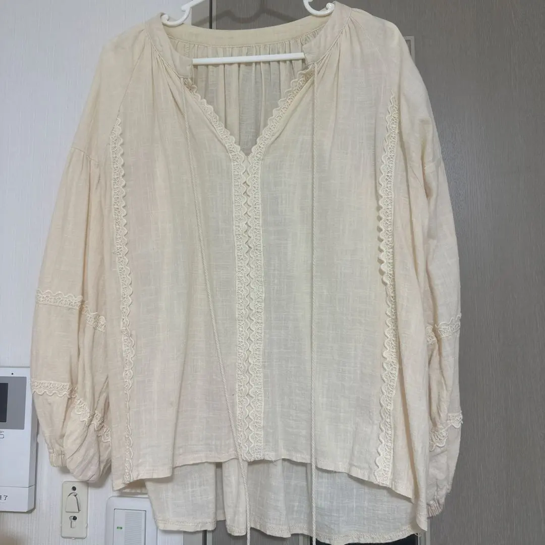 Thumbnail of Cream-colored V-neck lace-trimmed shirt, beige