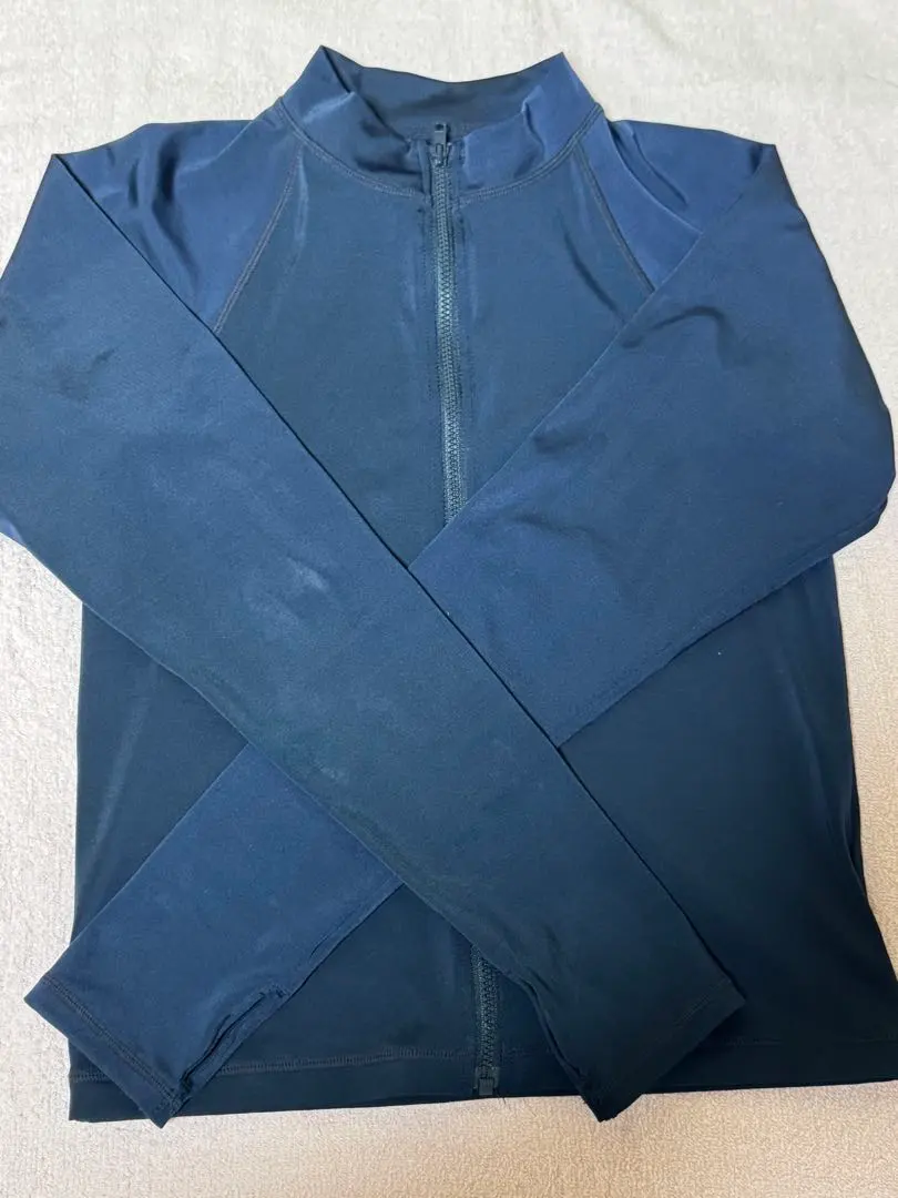 Thumbnail of Navy full-zip rash guard, size 150, in excellent condition!