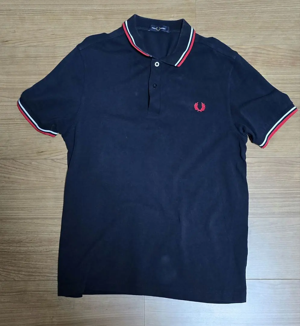 Thumbnail of Price reduced Fred Perry navy polo shirt, size L