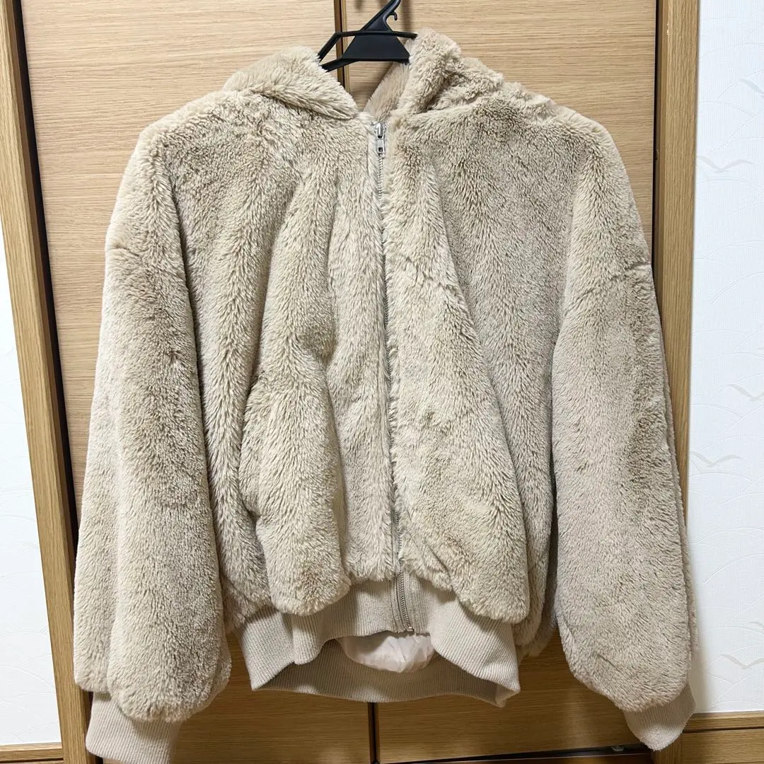 Thumbnail of Beige faux fur jacket with hood