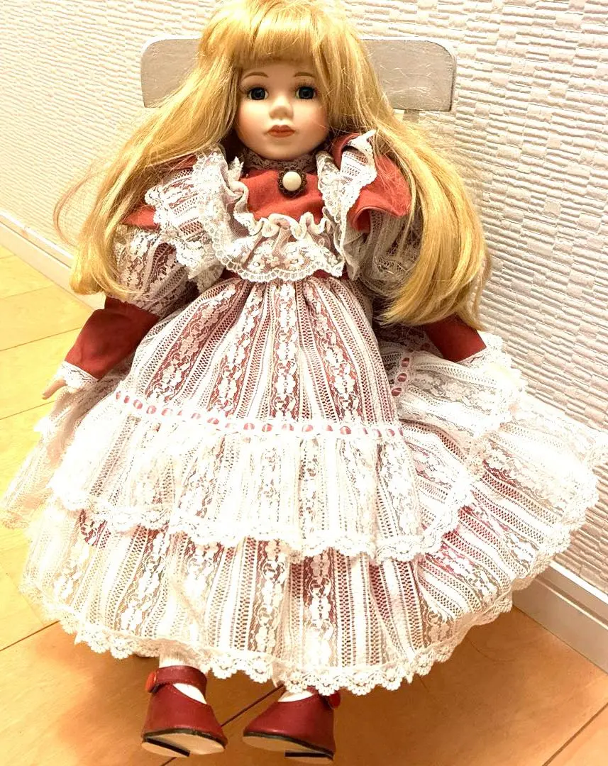 Thumbnail of Vintage doll, red and white dress, with doll chair, approximately 44cm