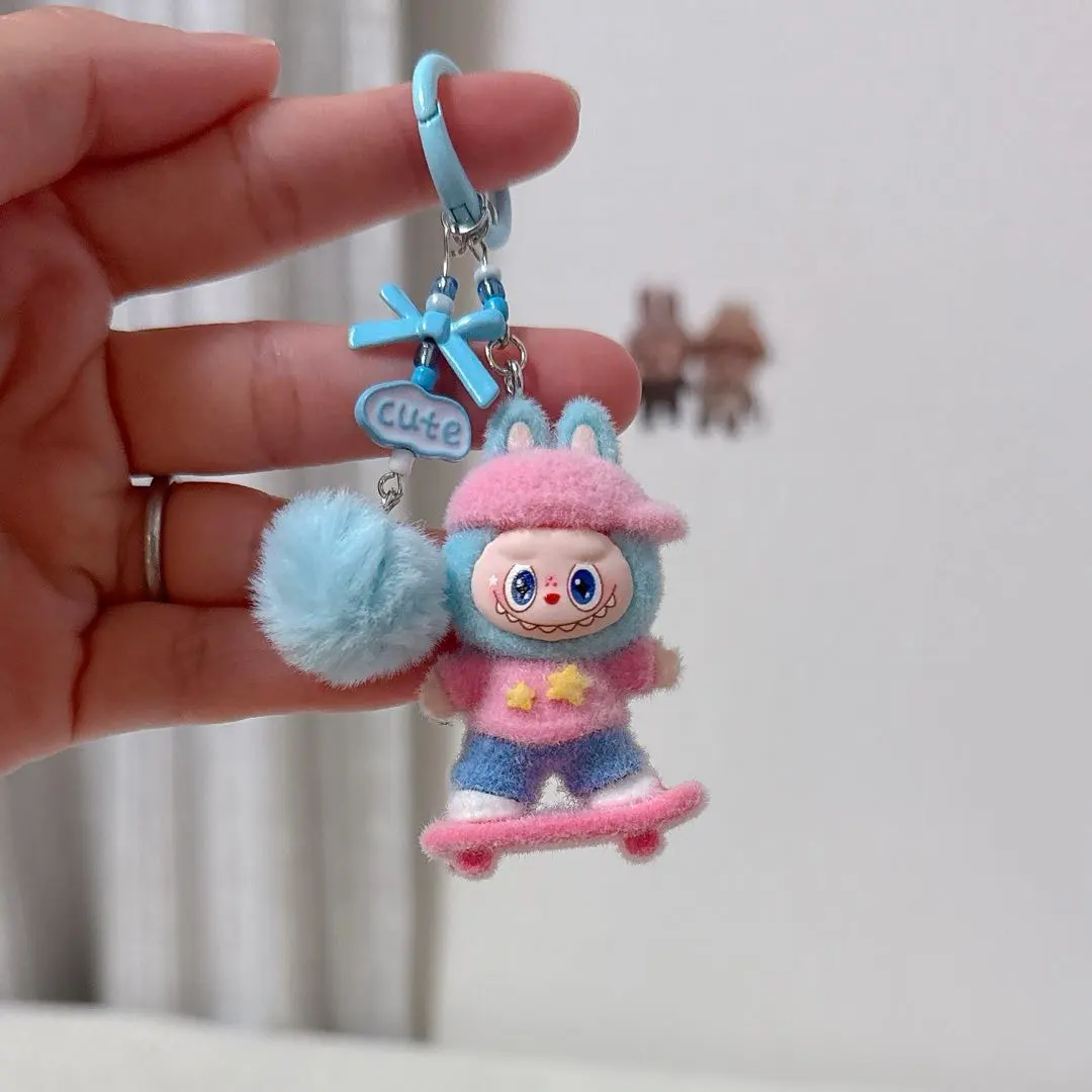 Thumbnail of Fluffy Loveboo Keychain: Skateboard Character & Pom-pom Charm