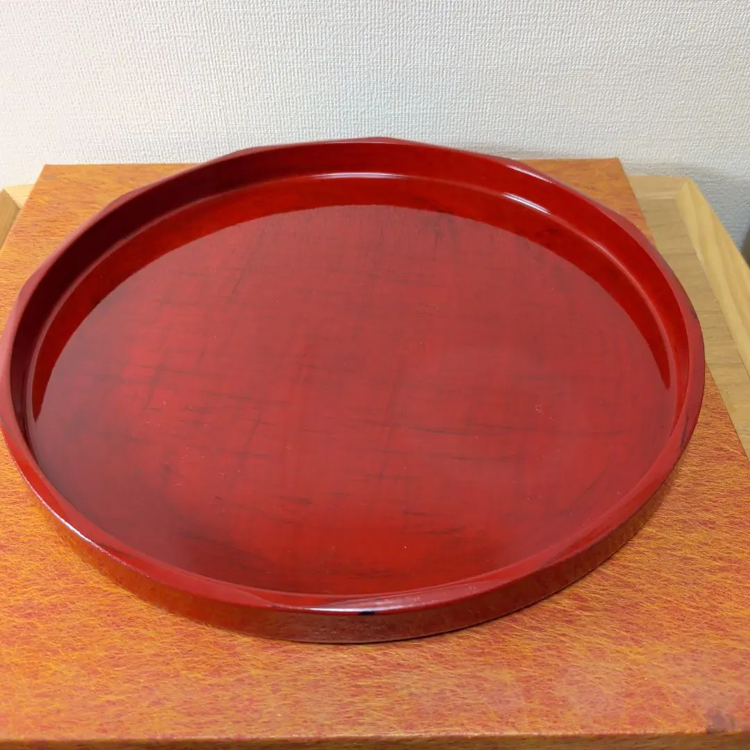 Thumbnail of Red lacquered circular tray, approximately 26cm in diameter, urushi lacquer finish
