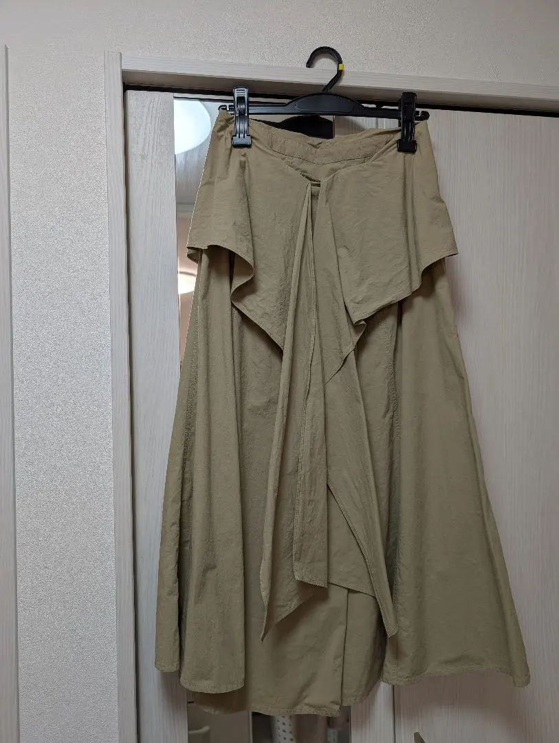 Thumbnail of Beige flared long skirt with ribbon