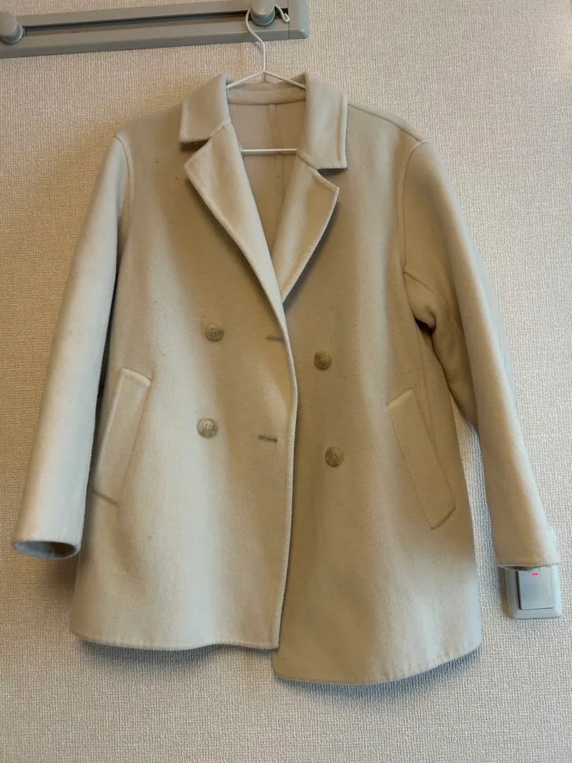 Thumbnail of UNIQLO cream-colored coat