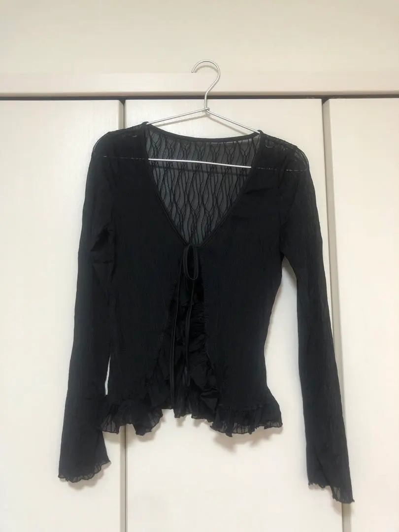 Thumbnail of Black V-neck long-sleeved cardigan with frills
