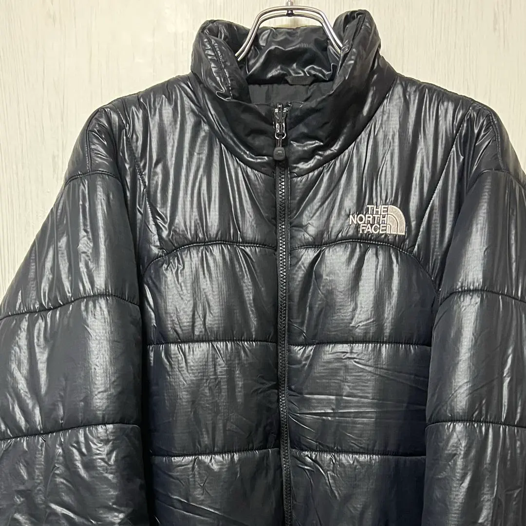 Thumbnail of The North Face black down jacket