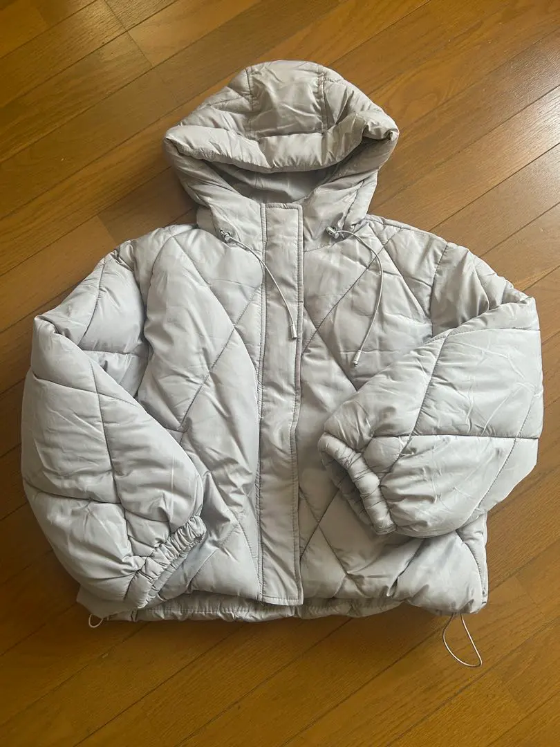 Thumbnail of Light gray quilted jacket with hood