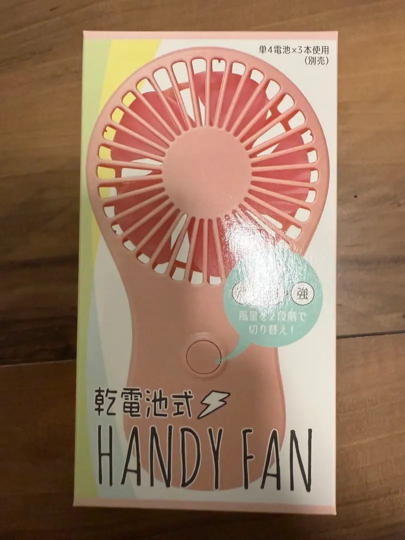 Thumbnail of Handheld fan, pink, approximately 15 x 13 x 3cm