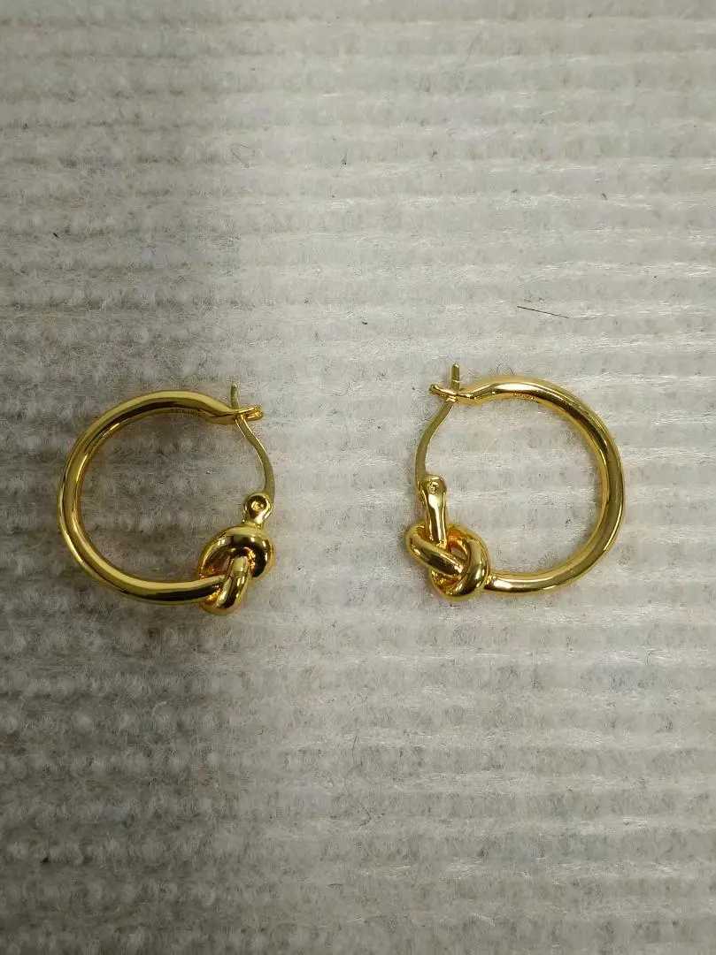 Thumbnail of Gold knot design earrings, excellent condition