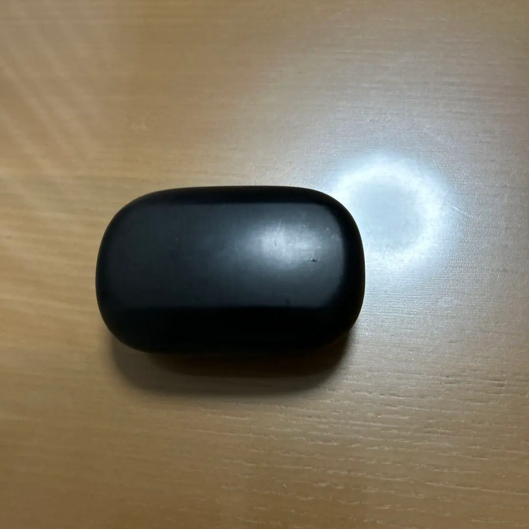 Thumbnail of Black wireless earphones with ear hooks