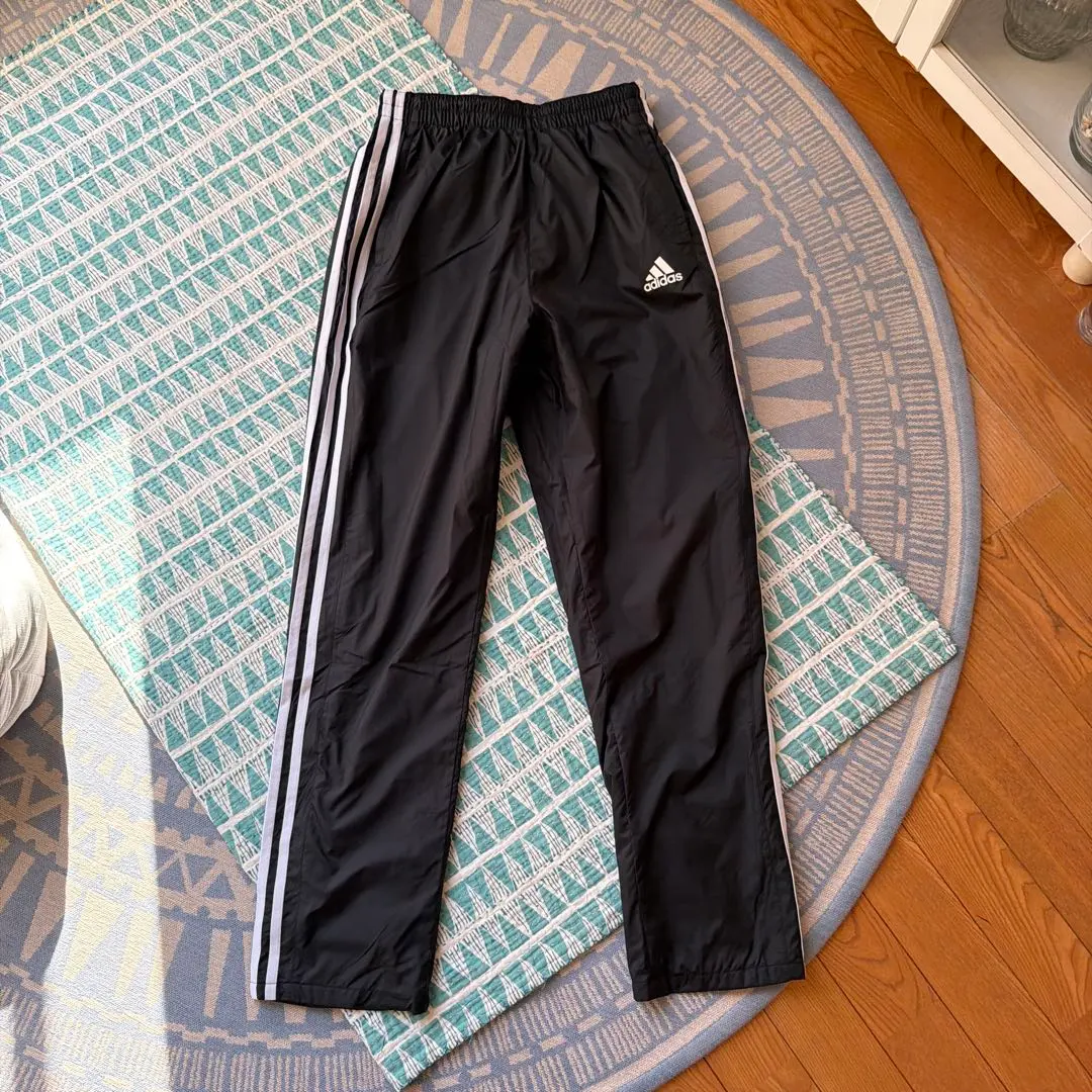 Thumbnail of Adidas black jersey pants with three stripes