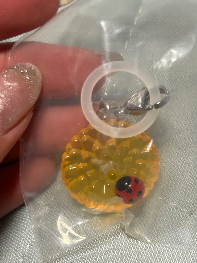 Thumbnail of Orange Chrysanthemum Capsule Toy with Ladybug