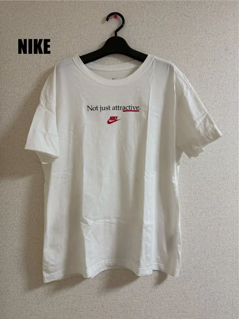 Thumbnail of NIKE White T-shirt. Not just attractive.