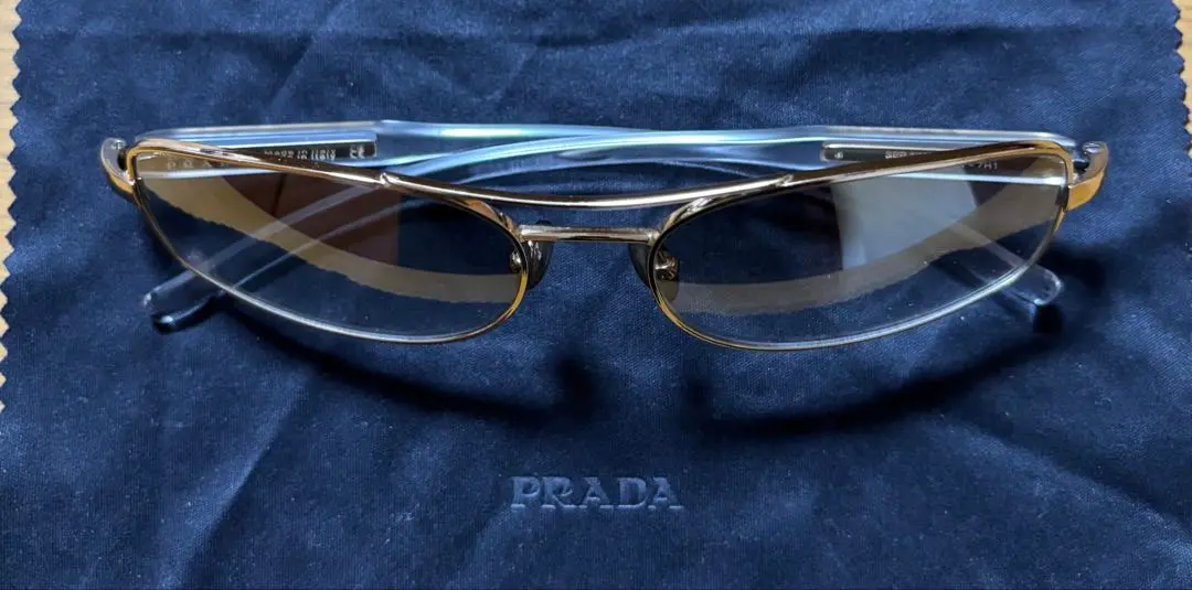 クリアフレーム ゴールドディテール サングラス　PRADA Loden Lenses Sunglasses with triangle logo | PRADA
