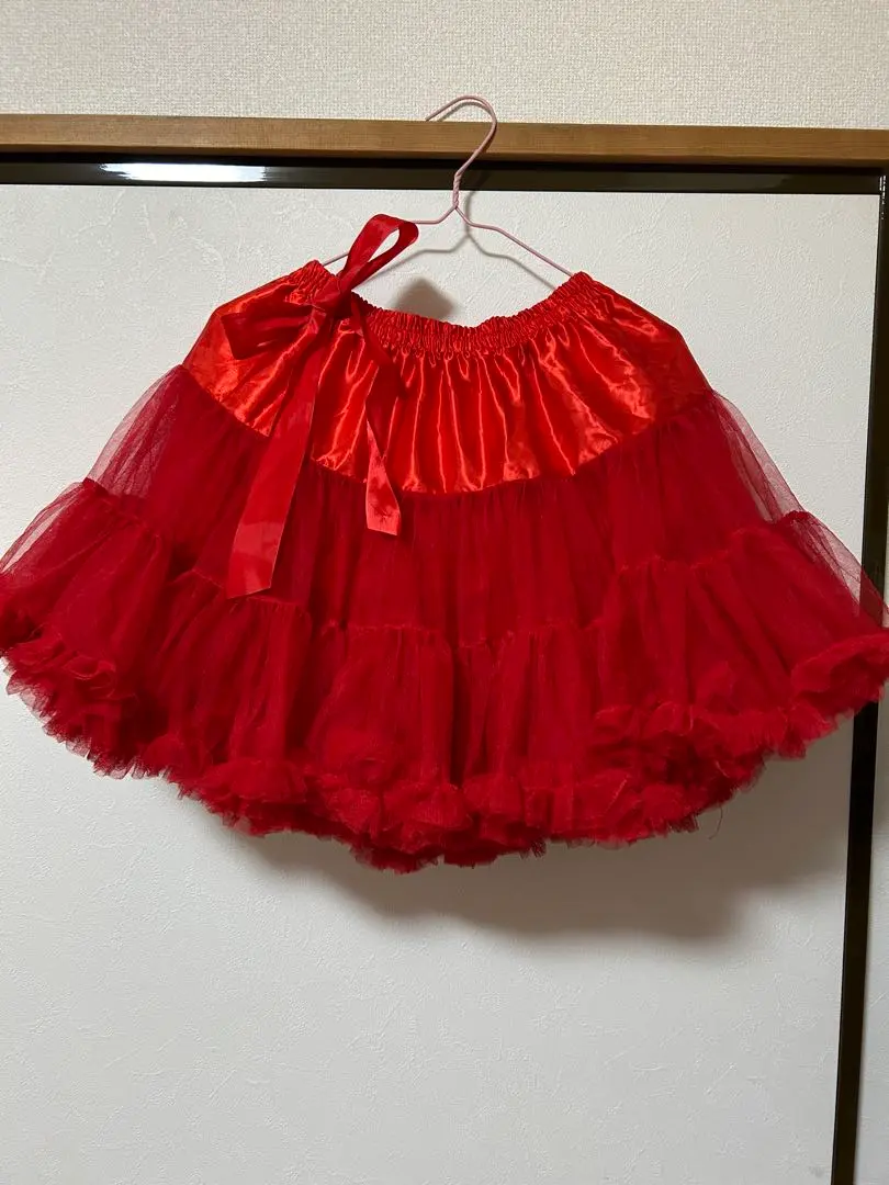 Thumbnail of A red tulle petticoat featuring ruffles and a ribbon. Length: 40cm