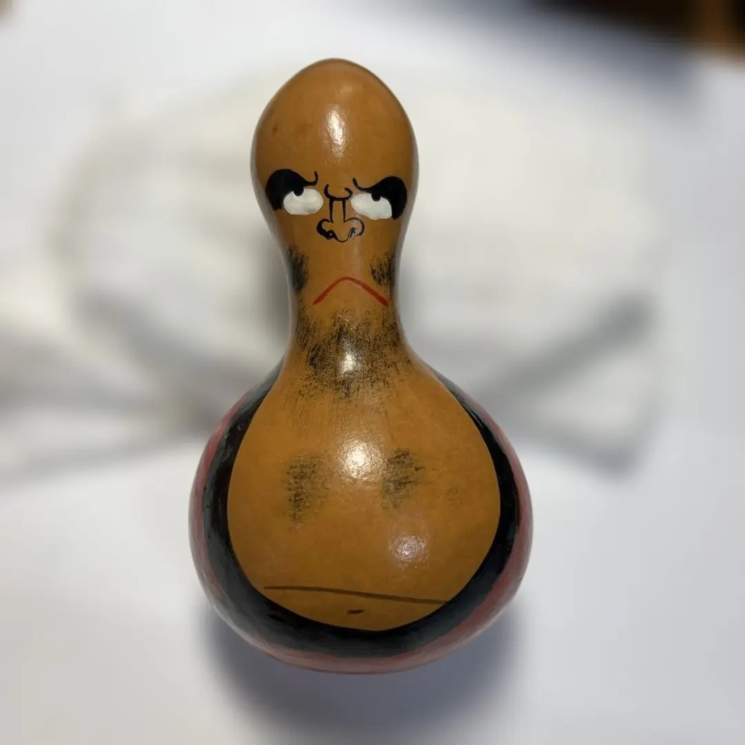 Thumbnail of A Daruma painted on a gourd.