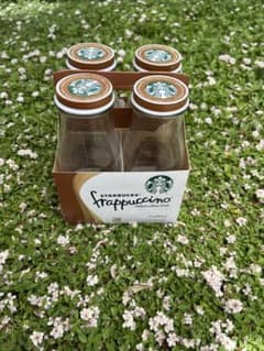 Empty Starbucks bottles from overseas, including Martinelli's apple juice bottles. Shipping included. Total of 25 bottles.