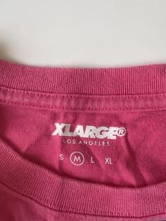 XLARGE ピンク Tシャツ ホテルロゴのサムネイル