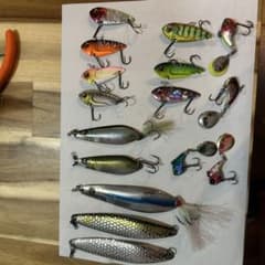 16-piece set of spoons, blade jigs, and vibration lures for bass fishing.