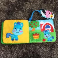 フィッシャープライス  めくってモー おでかけ！布えほんのサムネイル