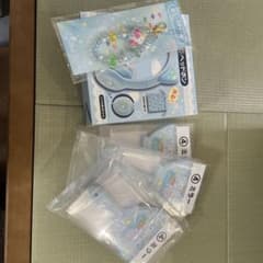 Sanrio headphones, mirror, and bead charm bundle.