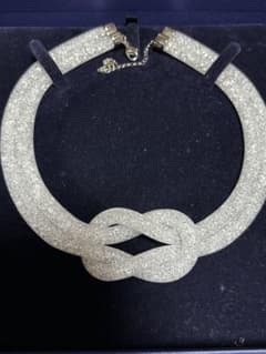 最終価格☆SWAROVSKI スターダストノットネックレス - メルカリ
