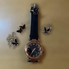 Unused women's watch with accessories included.