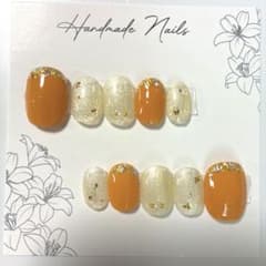夏色オレンジ×シャンパンラメ⟡.ニュアンスネイルチップ ゴールド ベリーショートのサムネイル