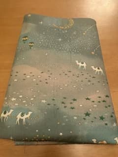 Luonto fabric with star and camel pattern