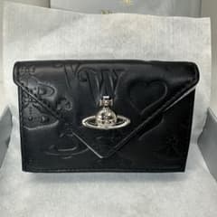 新品！大人気】Vivienne Westwood ミニ財布 型押し 黒 大人気 - メルカリ