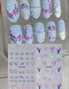 Nail stickers featuring mermaids, teddy bears, and Sailor Moon characters.