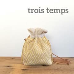 未使用【trois temps トロワトン】リボン織の巾着ポシェット 白×黄のサムネイル
