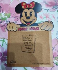 This is a Disney Minnie Mouse wooden cork board.