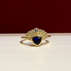 Vintage design black ring with gold stone, retro style.