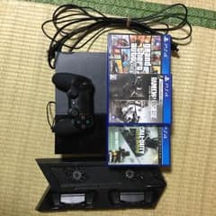 PS4 1100Aとカセット、冷却装置、コード、コントローラー。のサムネイル